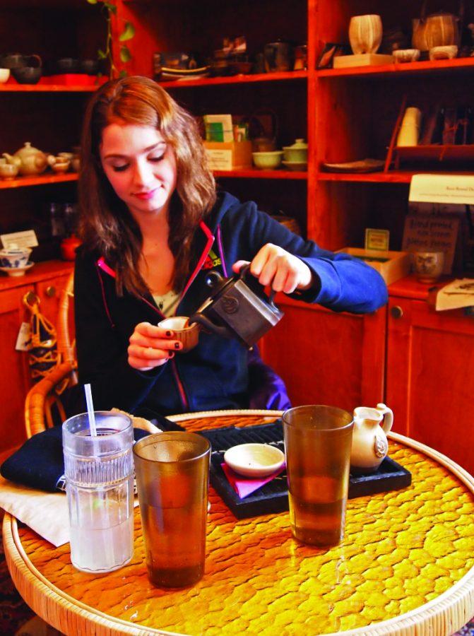 Photo by Ricky Emmons - Photography Editor. Annabel Kaufmann enjoys the free tasting at Dobra Tea this weekend.