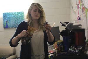 Classics student Melissa Huggins makes a cup of coffee in her resident hall. Coffee could pose a potential health risk to the DNA  of frequent drinkers, according to a study released this year.  Photo by Jorja Smith.