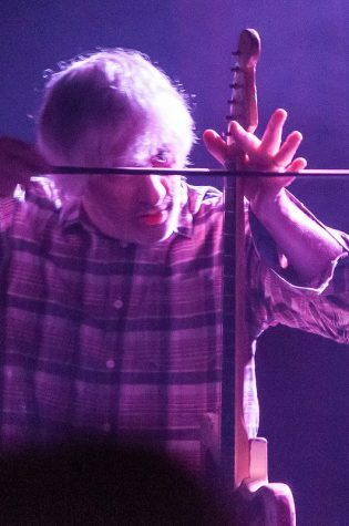 Lee Ranaldo traded pick for bow during a particularly noisy song at the Orange Peel last Wednesday.