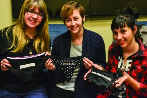 Left to right: Jess Frayer, a 19-year-old psychology student, Peyton Kennedy, a 21-year-old anthropology student and Janie Warstler, a 20-year-old junior, display consensual underwear. Members of the SPEAK Up organization. modified underwear in order to promote consensual sex. Photo by Brian Vu - Staff Photographer