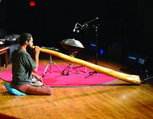 Photo by Brian Vu - Staff Photographer Improvisational musician and Asheville resident Peter Levitov performs on a didgeridoo during TEDx in Lipinsky Auditorium last Saturday.