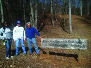 Nambi Ndugga, Ellen Pearson and David Moore volunteer their time for the South Asheville Colored Cemetery Project. Photo by Valerie McMurray - Staff Writer