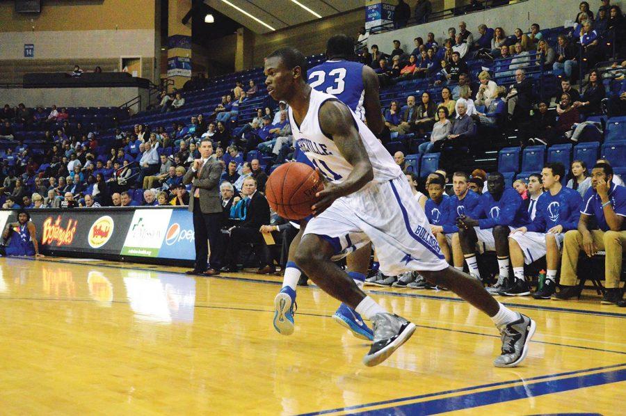Marcus Neely, a rising sophomore, gains possession of the ball during the exhibition game against Brevard College.
Photo by Max Carter