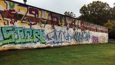 Colorful graffiti covers a Riverside Drive warehouse in Asheville. (Photo by Lee Elliott, contributor)