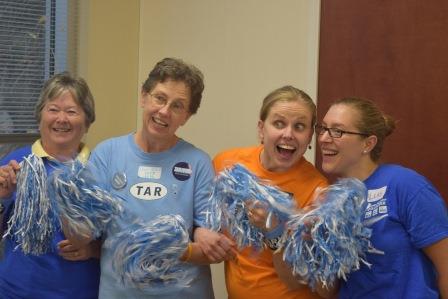 Leslie Newman, in orange, poses, from left to right, with a volunteer named Betty, her mother, and her friend Leah McDowell. (Photo by Becca Andrews, News Staff Writer)