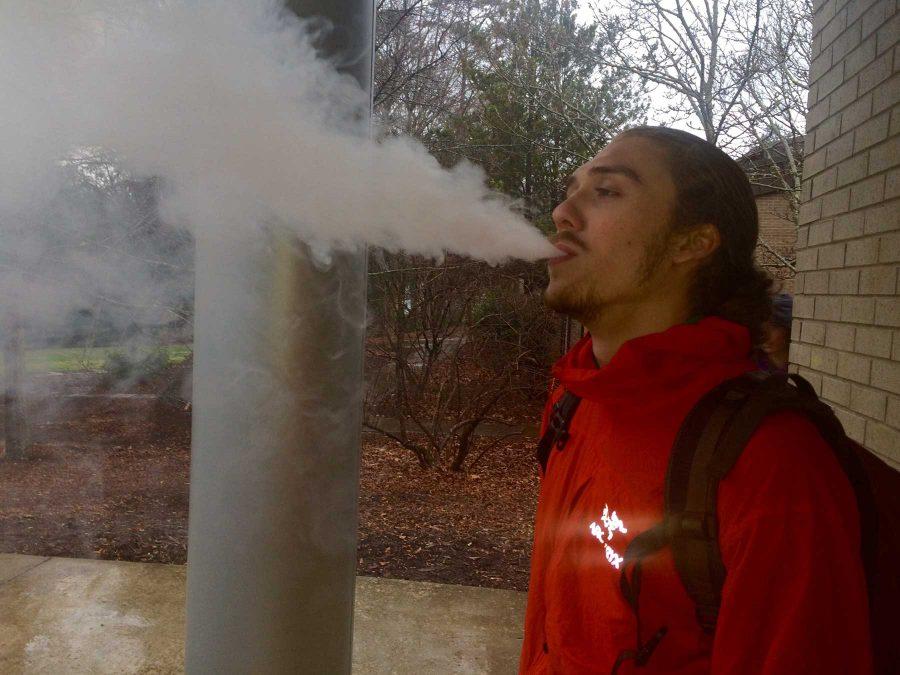 Gordon Gellatly, a senior from D.C. blows a vape cloud outside of New Hall between classes. (Photo courtesy of Joshua Alexander)