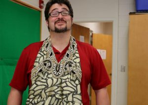 Rob Berls displays the dress of Dionysus