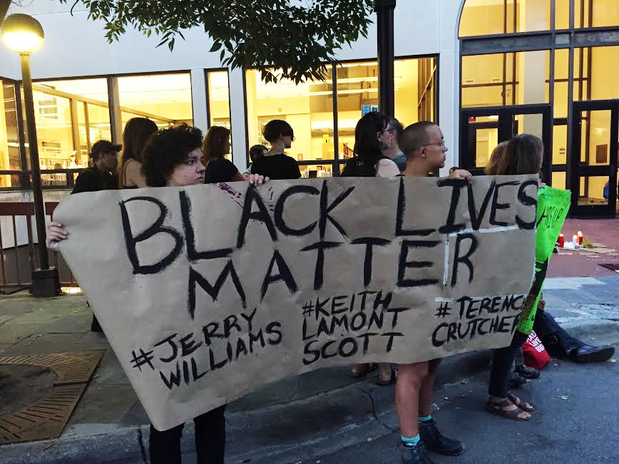 Residents of Asheville hold protest in memorium for African-Americans who have lost their lives to police brutality. Photo by Catherine Pigg.