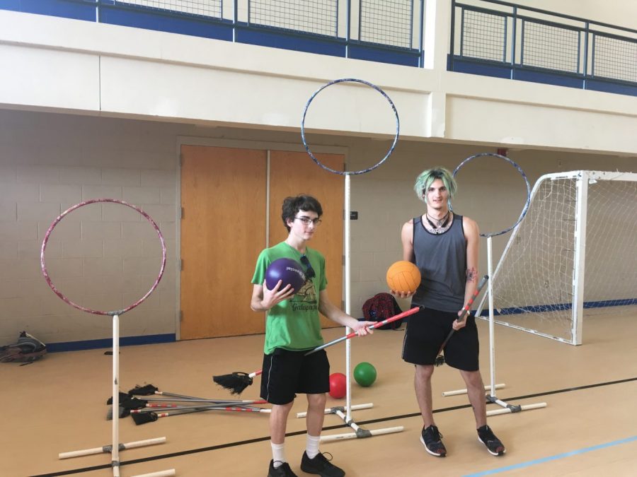 Nathan Lasala and Joseph Clay demonstrate quidditch. Photo by Cassidy Fowler.