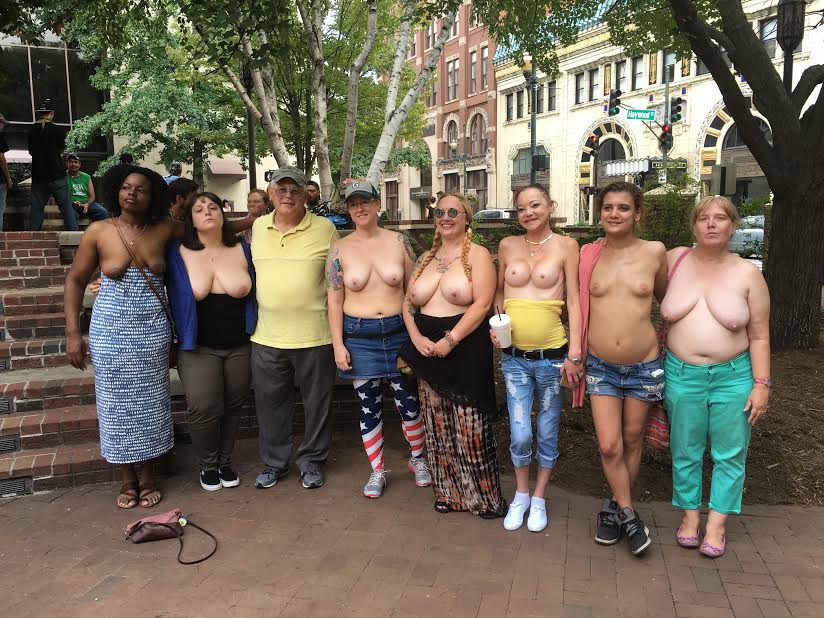 Women participate in a topless rally on Sunday at Pritchard Park in Downtown Asheville. Photo by Karrigan Monk.