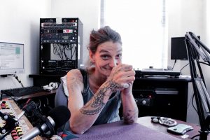 Abby Roach, "The Spoon Lady," sits at her desk at WPVM 103.7 FM. Photo by Jonathan Price.