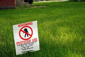 A sign warns citizens of the dangers of pesticide use. Photo courtesy of Flickr user Spaceman.