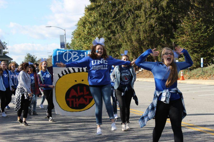 Excited sisters of Gamma Phi Beta bring energy to the homecoming parade. Photo by Laura Hoffman.