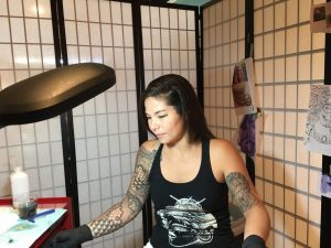 Kimi Leger in her station at her tattoo shop Sacred Lotus Tattoo. Photo by Karrigan Monk.