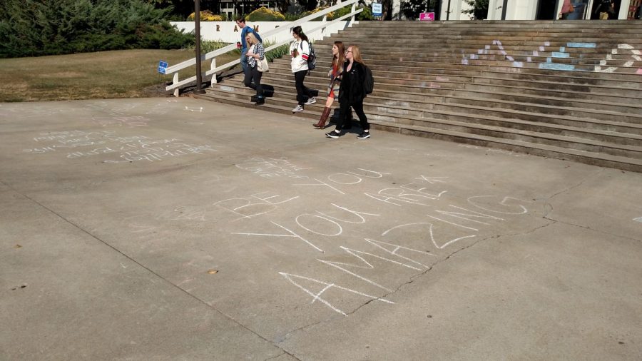 Chalking is an easy and inexpensive way to get messages across to students on campus. Photo by John Mallow.