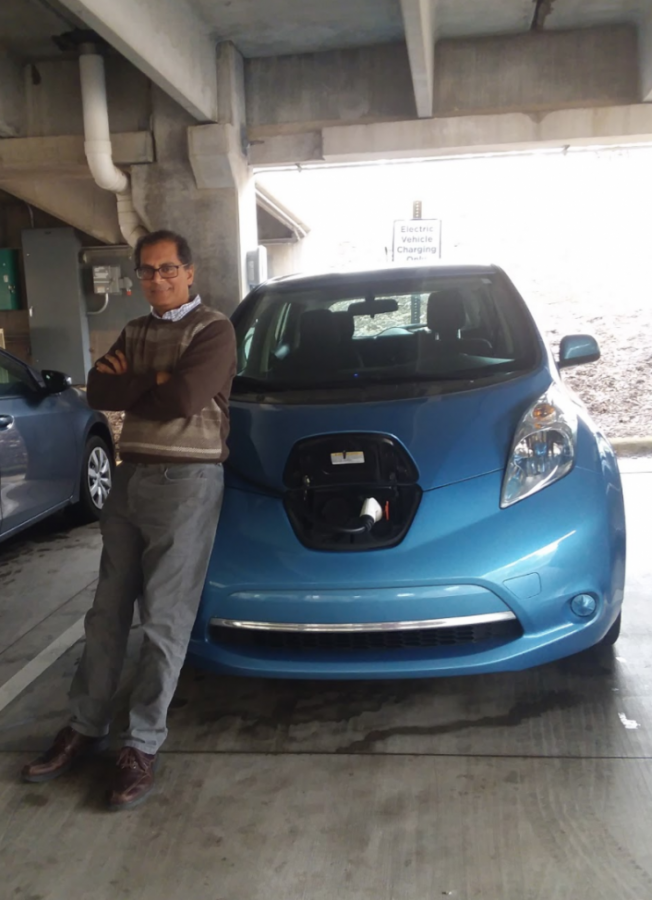Rudy Beharrysingh with his Nissan Leaf at the new chargers on campus. Photo courtesy of Rudy Beharrysingh.