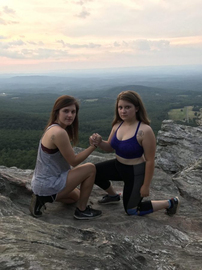 Olivia Rodrigues has matching tattoos with her best friend mimicking their favorite photo pose. Photo courtesy of Olivia Rodrigues 