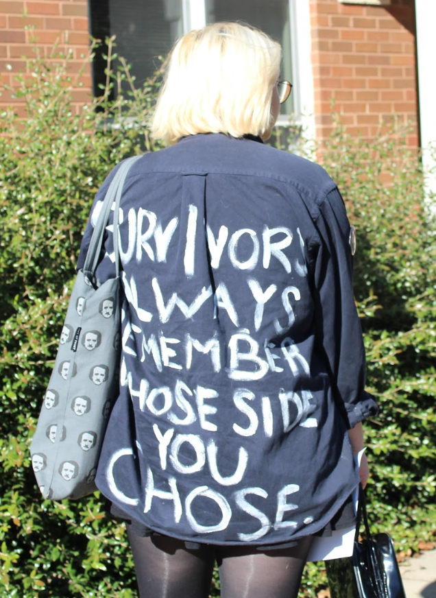 Maggie Haddock wearing a jacket she uses as a form of silent protest with the phrase, survivors always remember whose side you chose. Photo by Emma Jordan.