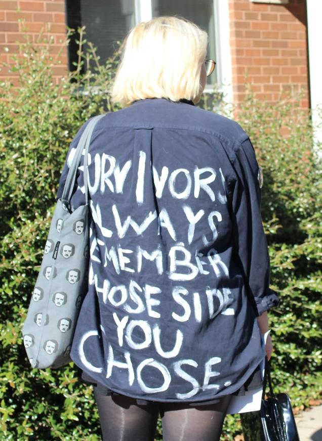 Maggie Haddock wearing a jacket she uses as a form of silent protest with the phrase, "survivors always remember whose side you chose." Photo by Emma Jordan.