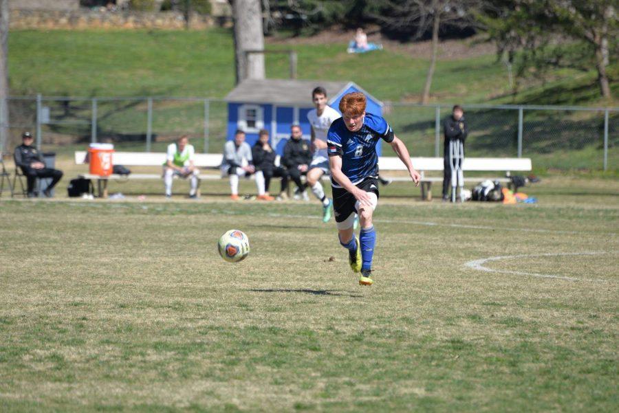 Izaiah Vignali, No. 8, runs after the ball during a game against Wofford College. 