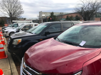 A line of cars display parking violations for parking in an unauthorized location on campus. Photo by Leslie Rodriguez