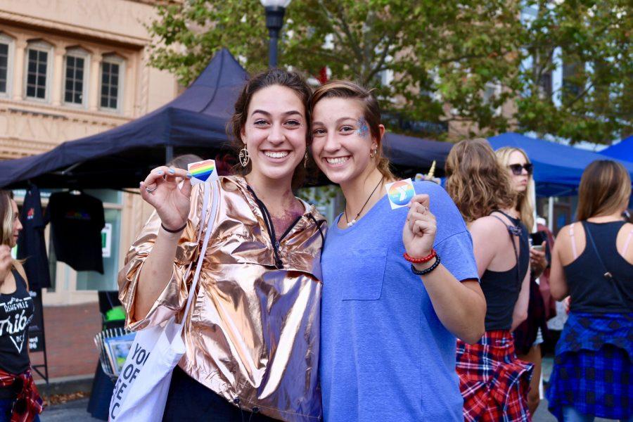 Photo by: Emily Arismendy UNCA freshman Sam Shepard and Emily Shepard show of their pride stickers.