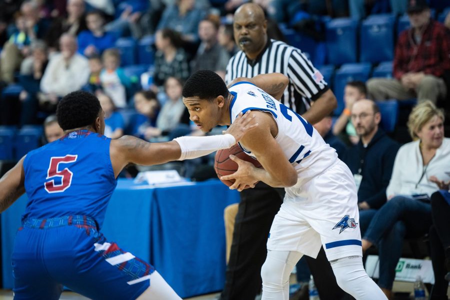 Photo by: Adrian Etheridge Devon Baker guards the ball during a game against UNCA’s Big South rival Presbyterian College.