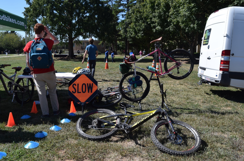 Table of local bike shop at Bulldog Bike Bonanza, an UNCA event to promote bicycles.