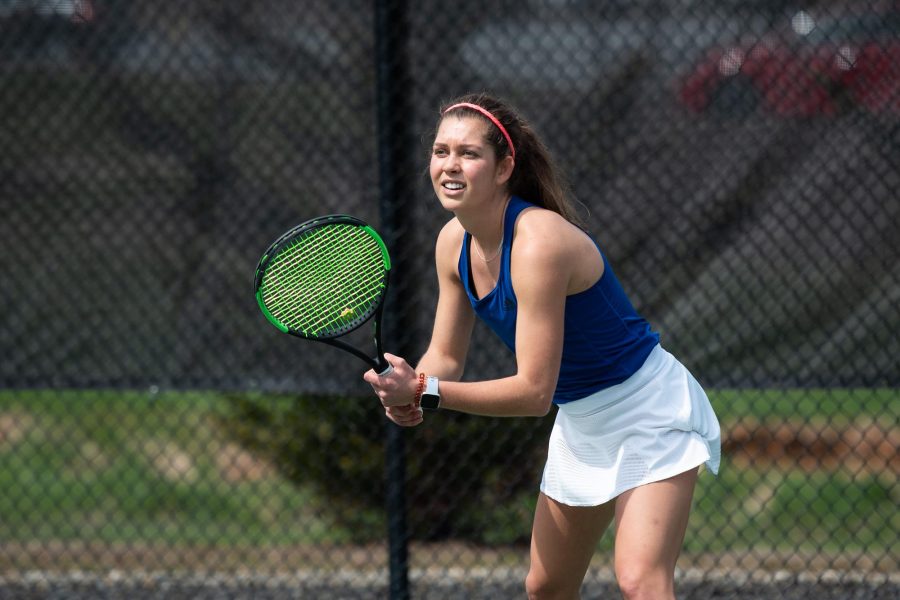 Photo By Adrian Etheridge
Emily Sidor, senior co-captain for the women's tennis team, get ready to hit a shot during her match.