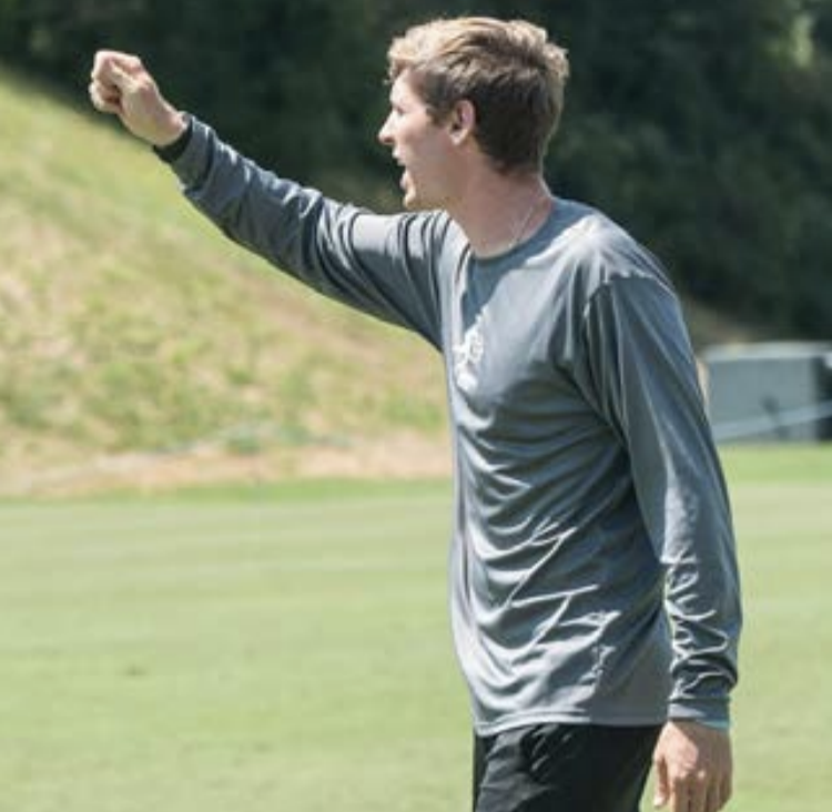 Photo provided by UNCA Athletics
UNC Asheville’s new Interim Head Coach Mick Giordano giving out instructions
to players last season during a soccer match.