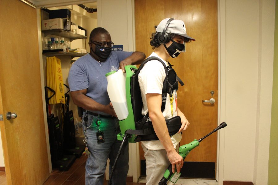 Photo by Lindsey Ratliff Housing Operations Assistant Adam Wan and his Supervisor Lawrence Bowen gearing up to disinfect UNC Asheville Woods apartments.