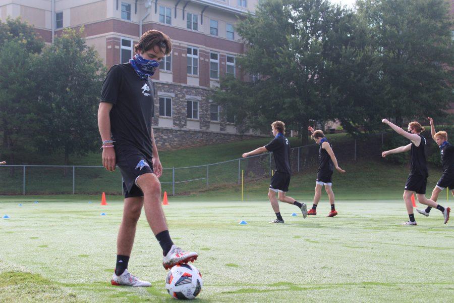 Photo By Lindsey Ratliff UNC Asheville’s Men’s Soccer Defender Lane Carroll wearing his mask during training.
