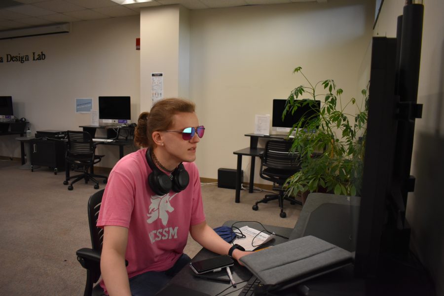 Photo by Lauren Callaghan           UNCA student, Storm DeChant works on a project in the Media Design Lab.