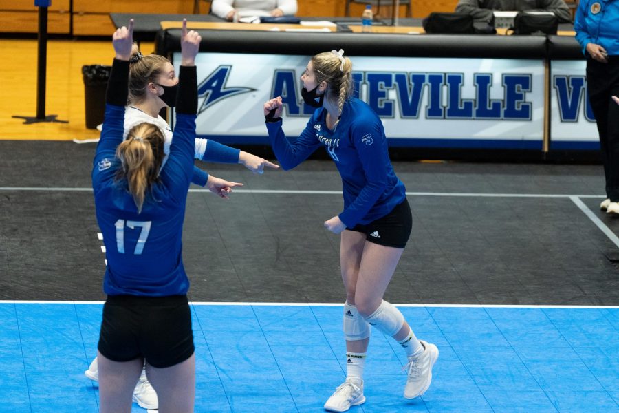 Photo Provided by UNC Asheville Athletics
UNC Asheville volleyball teammates celebrate after a point during a February match against High Point.