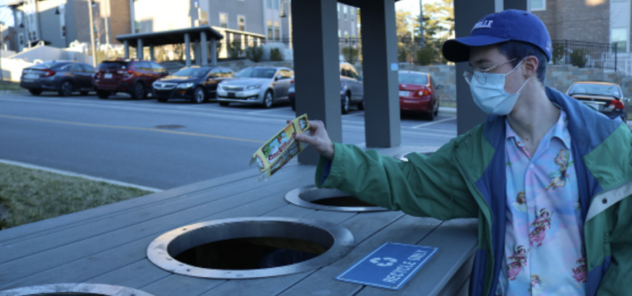 Photo by Xander Lord
Second year Mass Communications major Ian O’Brien properly disposing his trash to help keep the campus green.