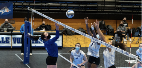 Photo provided by UNC Asheville Athletics
Senior Cecilia Stack contests a ball at the net against High Point. Due to COVID-19 safety protocols, all volleyball teams competed with masks on this past season. 