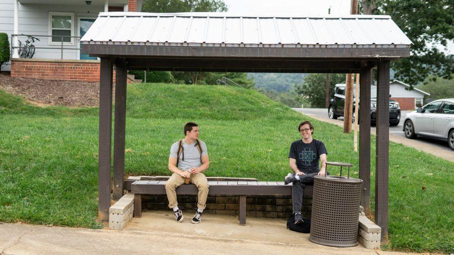 Photographed by RaeAnne Genth
Junior Charlie Kelsey and Senior Hunter Griffith wait for the red line shuttle at Hawthorn Creek shuttle stop.