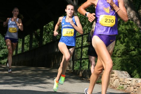 Photographed by Walker Lezotte
Clara Wincheski, a UNCA senior cross country runner, competes at the Covered Bridge Open at Appalachian State University on Sept. 3.
