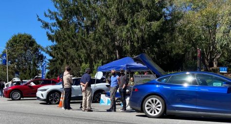 Photographed by Jackson Lockard.
Attendees learn more about current electric vehicles at an exposition held at UNCA.