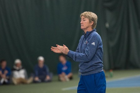 Coach Lise Gregory applauds her team during a match. 