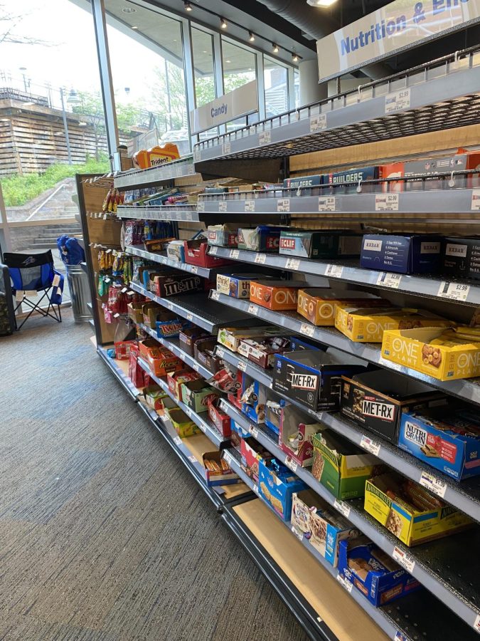 Shleves inside of the UNCA Bookstore that offer groceries and convenient snacks not allowed on one-cards or meal plans
