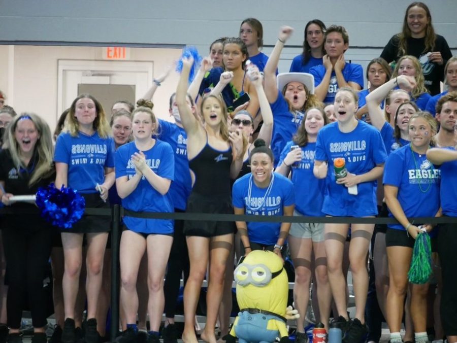 The+UNCA+swim+and+dive+team+cheering+for+the+mile+at+the+CCSA+Conference+Championships%0A