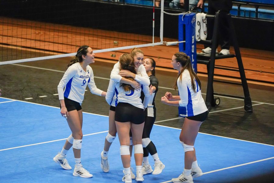 UNCA celebrates winning a crucial point. 
