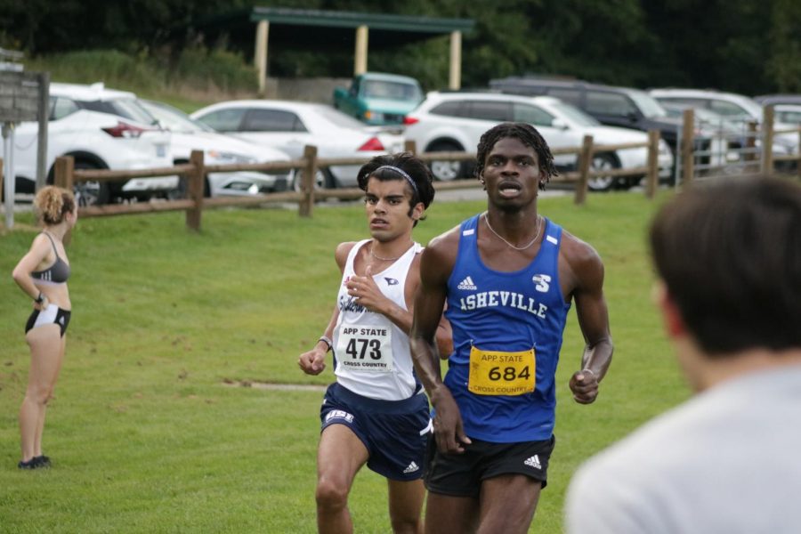 UNC Asheville mens cross country junior Andrew Okon finishes the race at the Covered Bridge Open on Sept. 2.
