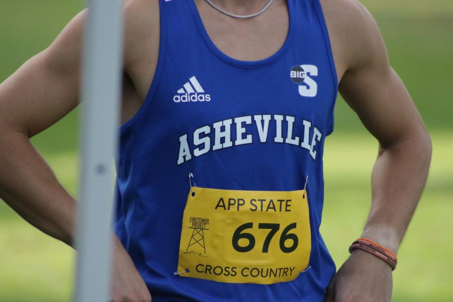 UNC Asheville mens cross country junior Jackson Core warms up to race at the Covered Bridge Open on Sept. 2.
