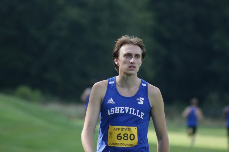 UNC Asheville mens cross country junior Daniel Hopkins runs down the final stretch at the Covered Bridge Open on Sept. 2.
