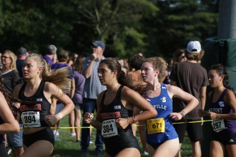 UNC Asheville womens cross country freshman Sophie Lundin runs around a corner at the Covered Bridge Open on Sept. 2.

