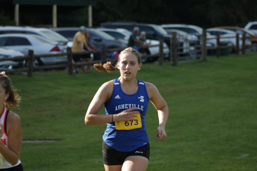 UNC Asheville womens cross country junior Amanda Orban chases down competition at the Covered Bridge Open on Sept. 2.
