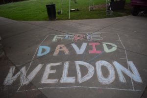 Sidewalk chalk protesting David Weldon, the director of emergency management. 