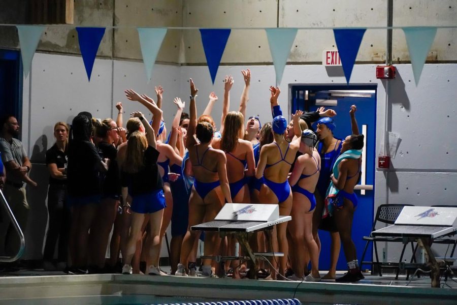 The UNC Asheville Swim & Dive team huddle before their meet against the East Carolina Pirates on October 1st. 
